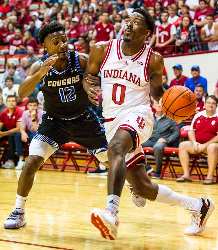 Indiana's Xavier Johnson (0) drives past St. Francis' Antwaan Cushingberry (12) during the Indiana versus St. Francis men's basketball game at Simon Skjodt Assembly Hall on Thursday, Nov. 3, 2022.